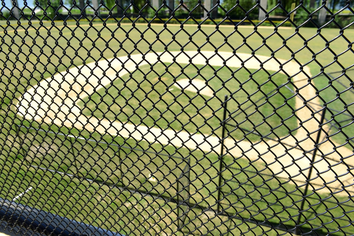 Baseball field as viewed through chain linked fence